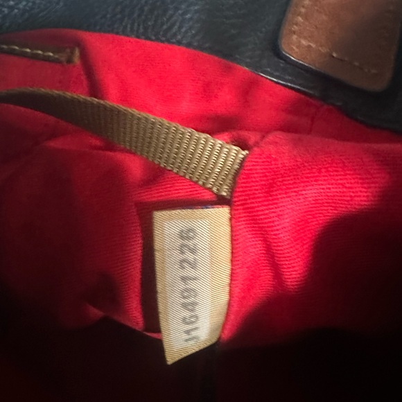 Dooney & Bourke black & brown leather shoulder bag with gold “C” ring/clasp. - Picture 5 of 13